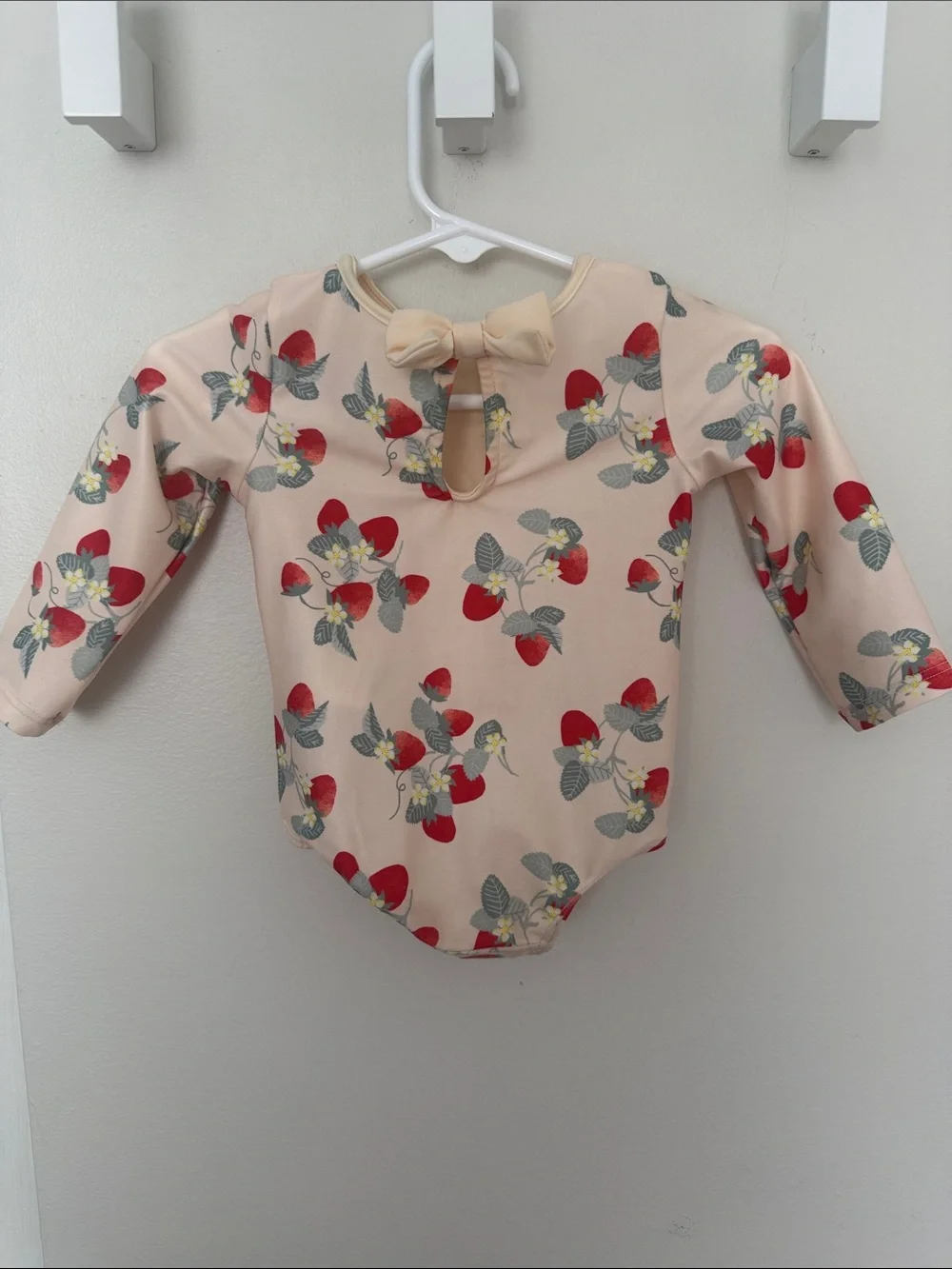 H&M Peach-Pink Long-Sleeve One-Piece with Red Strawberry Print